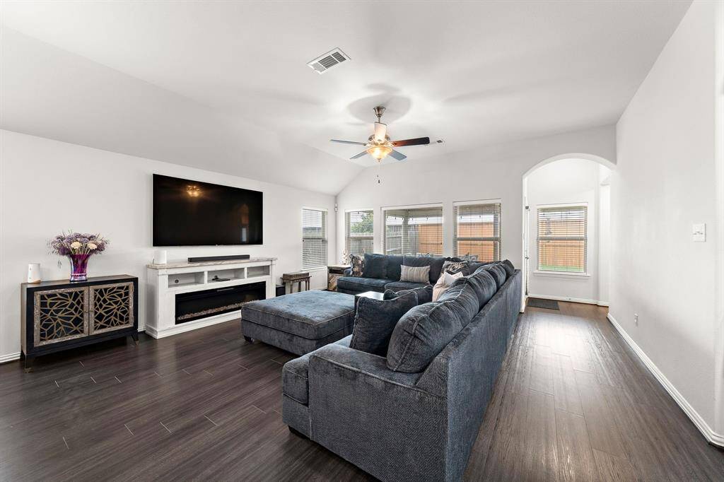 Bright and inviting living space with abundant natural light, perfect for relaxation and entertaining.