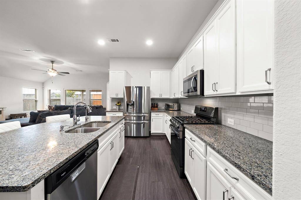 Sleek stainless steel appliances for a modern touch.