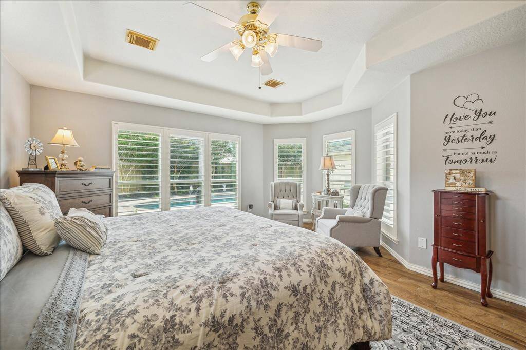 Another view of this Amazing Master Suite, Highlighting the Recessed Ceiling and Floor to Ceiling Windows with Custom Plantation Shutters.  Soooo High End!