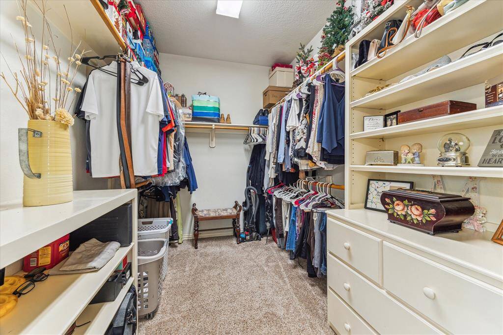Walk-in Master Closet with Custom Built In's for added organization.  Plenty of Space for Clothing, Shoes and Accessories!