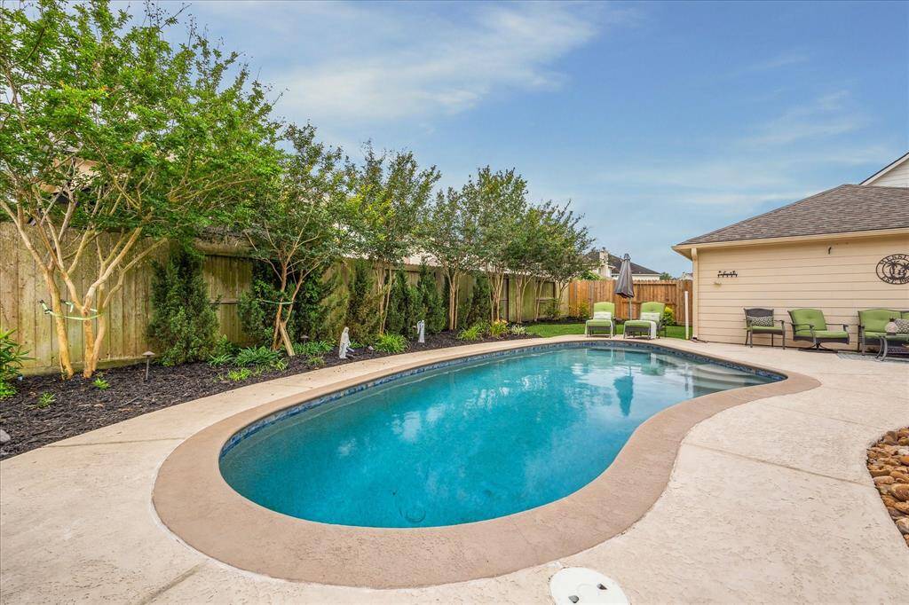 Gorgeous Gunite Pool & Spa!!!  Within the past 5 years Pool has been Resurfaced ~ Cool Touch Decking Added, ~ Pool Pump Replaced ~ Color Changing In Pool Lighting System Added!!!!  Bonus ~ All Pool Equipment Stays Including the Pool Cleaner!!!!