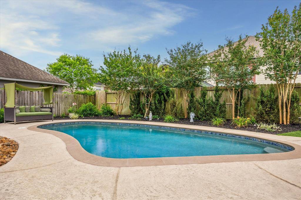 Another view of this Resort Style Backyard & Stunning Landscaping!!!!  You can literally vacation in your back yard 7 days a week!!!