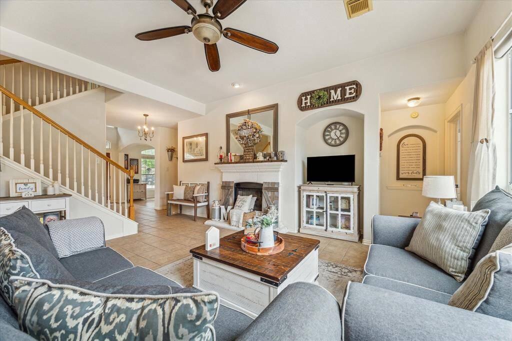 Another view of the Family Room, Highlighting a Stunning Gas Log Fireplace with Custom Mantel.  This Open and Modern Floor Plan has no wasted space & features Beautiful Architectural Details.
