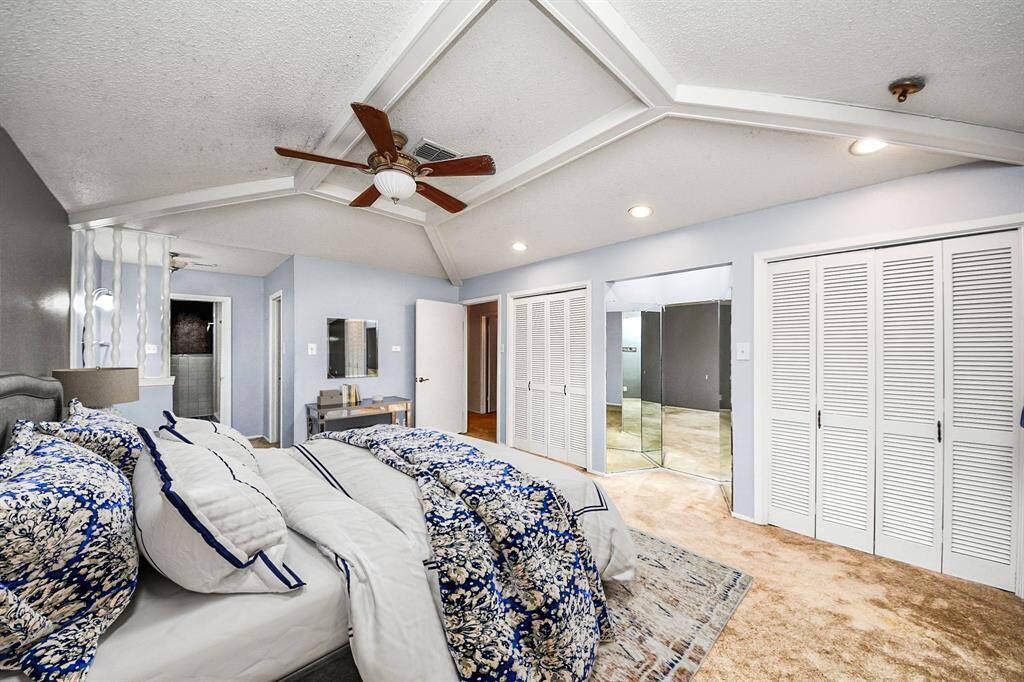 Spacious primary retreat with unique tray ceiling, recessed lighting, and dual closets—offering both comfort and character. A perfect space to unwind and recharge. Virtual staging used to help visualize the space.