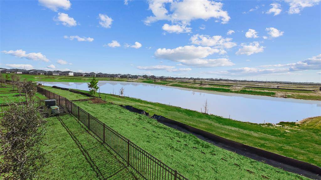 Beautiful new home in Sunterra Community. Everything New! Gorgeous Lake view! In The planned Community with a 3.5-acre Crystal Lagoon, part of a world-class amenities' village featuring a celebration lawn, beach-front clubhouse, splash pad, kid's cove, paddleboard and kayak launch, and white sand beaches