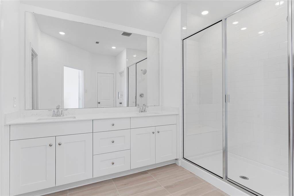 Wow!  What a private Primary Suite Bathroom!  Look at all the fabulous shaker cabinets and draws you have in this home for all your storage needs!  Most homes do not have all these cabinets and drawers in the bathroom like this New Home has!