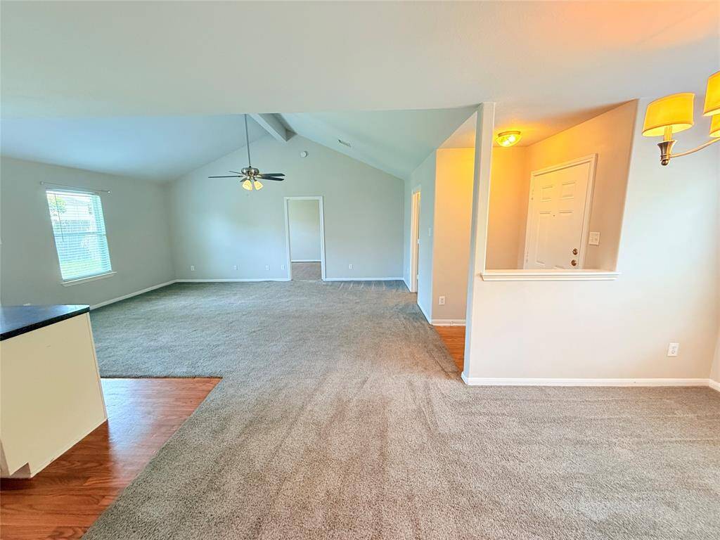 View into living room from dining room and kitchen