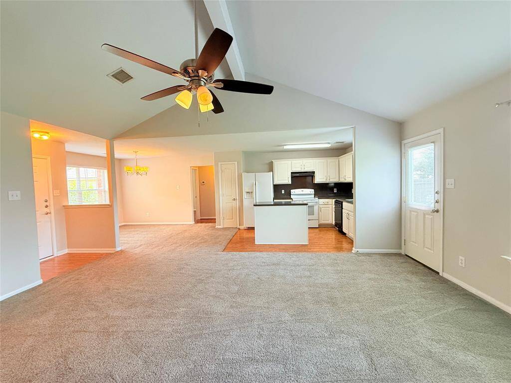 Living room, kitchen, and dining room