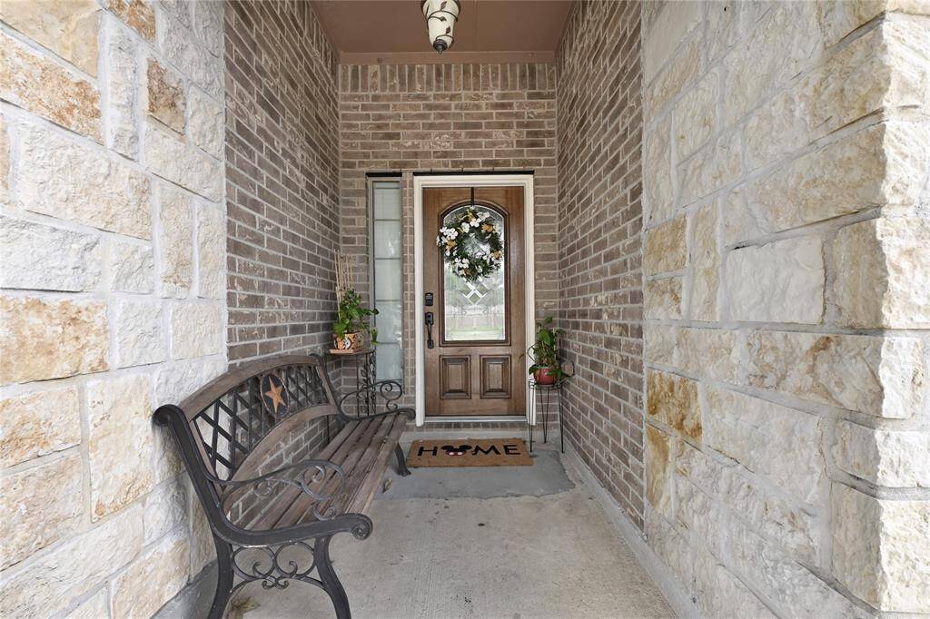 Beautiful Front porch that can be used for relaxing or protecting amazon packages.