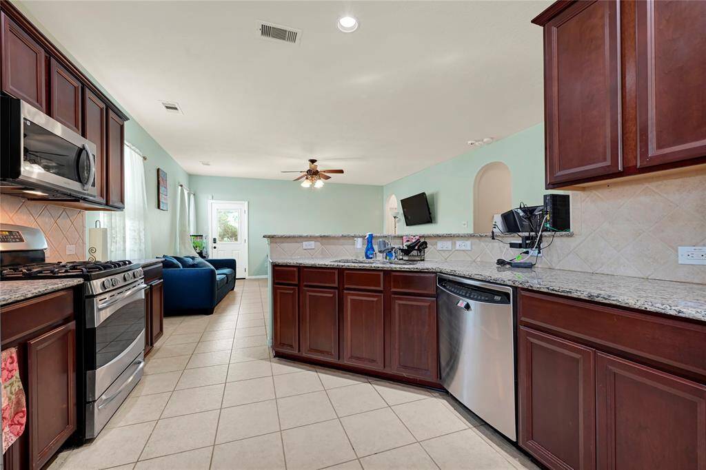 Open concept kitchen with lots of counter space and cabinets
