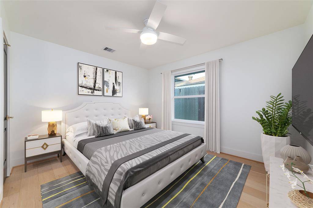 Second bedroom **virtually staged** towards the entrance of the home.