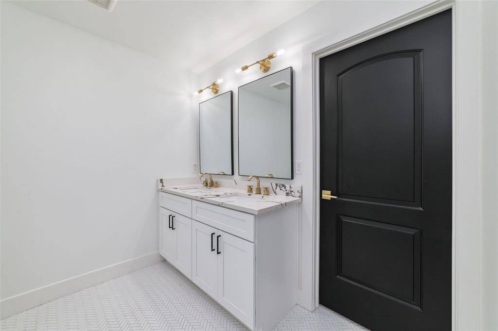 Double sink, so that you don't have to share yours! Stylish lighting and hardware.