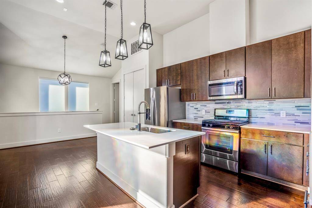 Great kitchen with quartz counters, gas range, and abundant cabinet space.