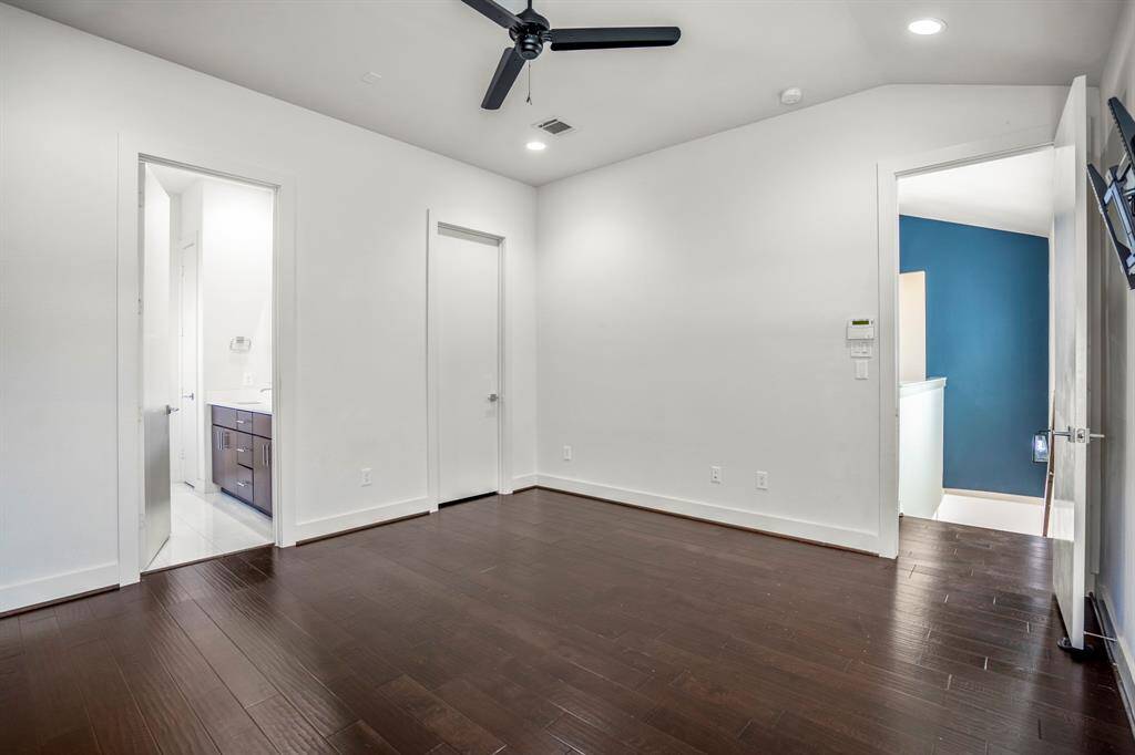 Ceiling fan and natural light make this room both functional and inviting.