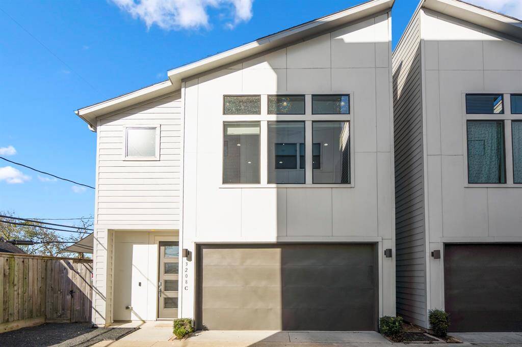 Attached two-car garage with additional storage space.