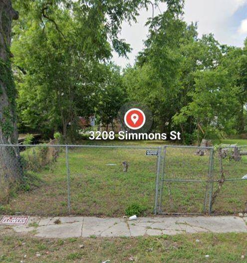 Front of lot with sidewalk.