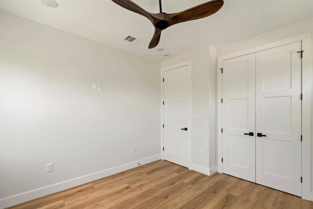 Each bedroom comes complete with stylish light fixtures and modern ceiling fans—perfect for those warm Texas nights.
