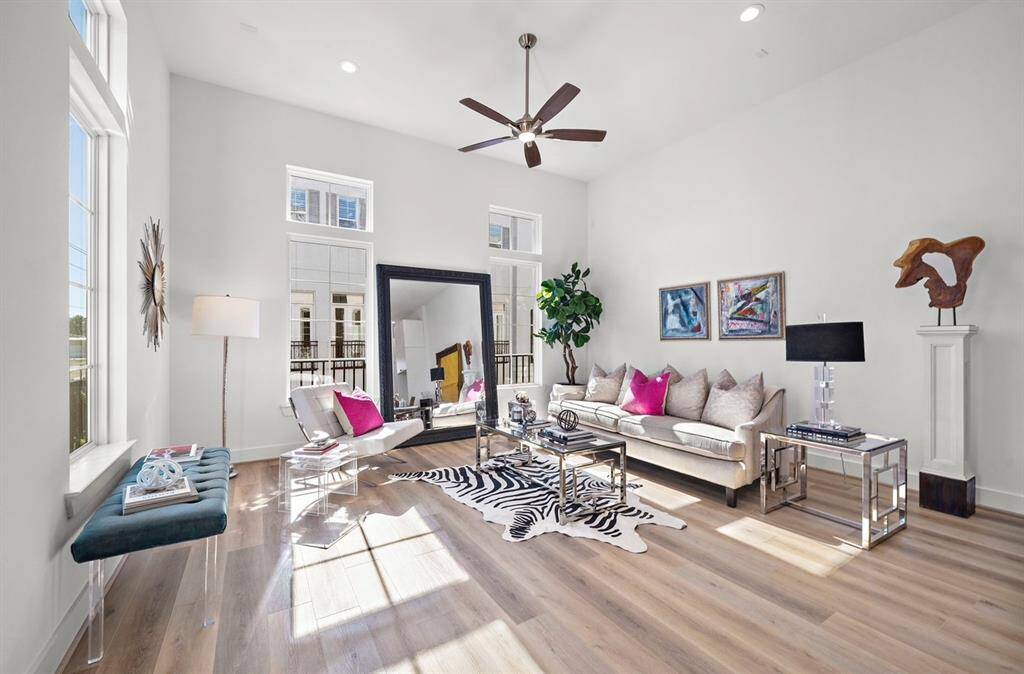 Here is a photo of another floorplan by Riverway homes with high ceilings, beautiful hardwoods, and lots of light.