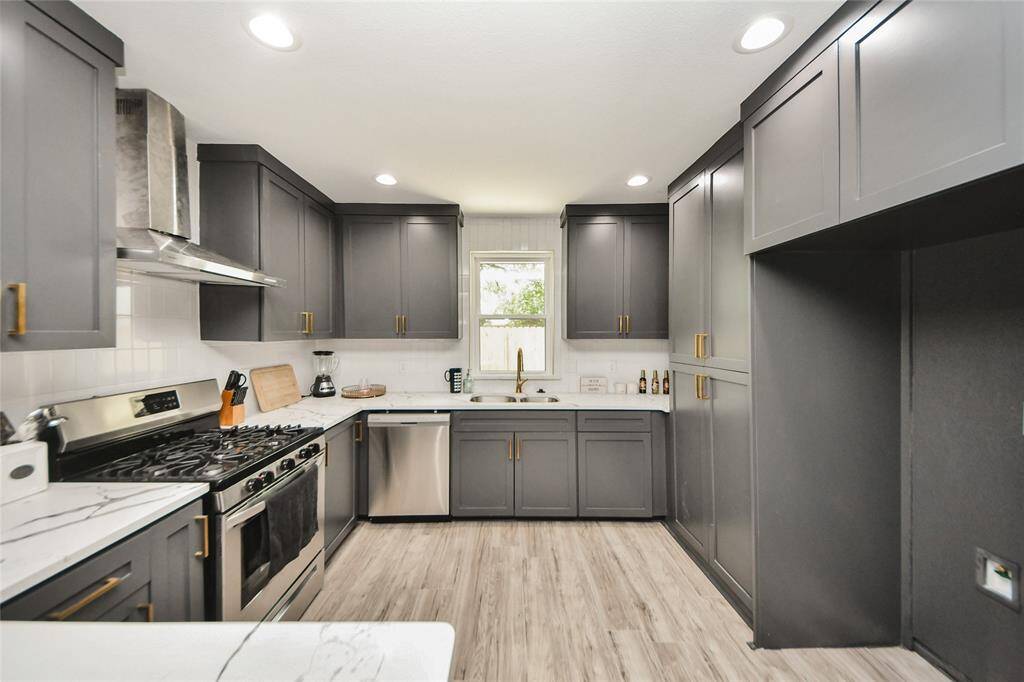 The kitchen features stainless deep sink