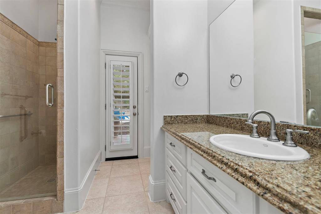 Full bath for bedroom #2. This also serves as the pool bath as it has access from the outside.