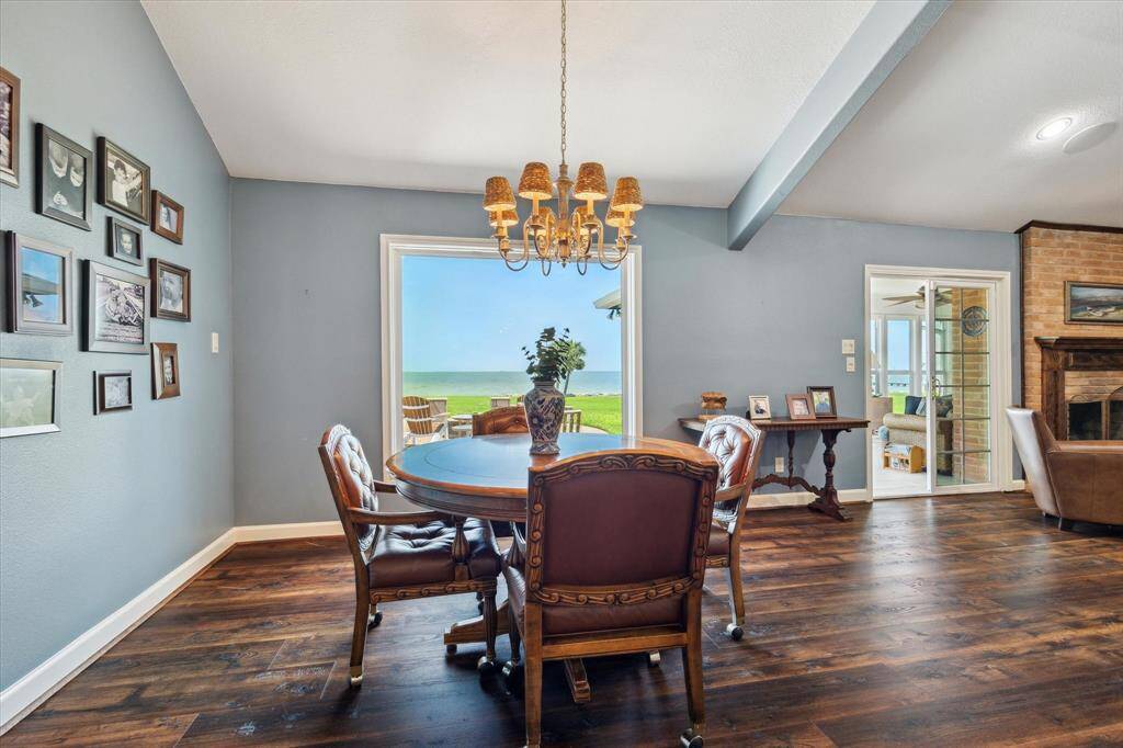 The breakfast area is just off the kitchen and at the end of the den. A 64"x70" picture window provides an incredible view of Galveston Bay.