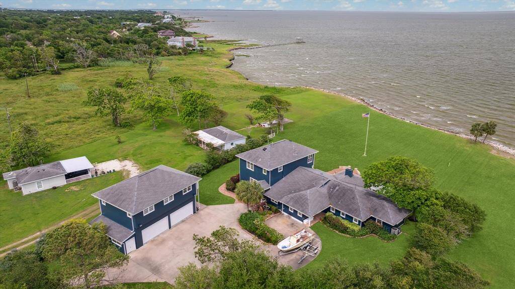 Aerial view of the property showing the expansive bay waterfront.