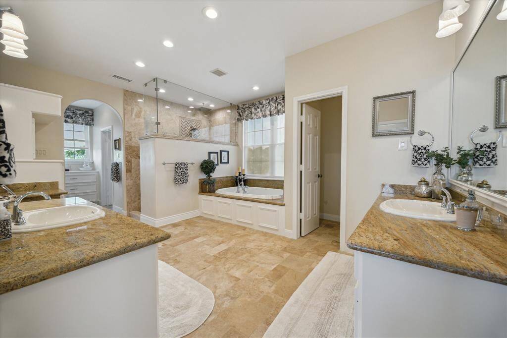 The view when entering the spacious, spa-like primary bath.