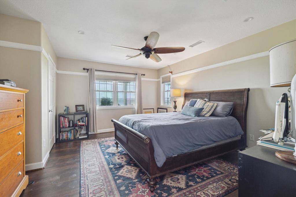 Bedroom 2 is on the lower level of the home at the backside. Double windows overlook the bay.