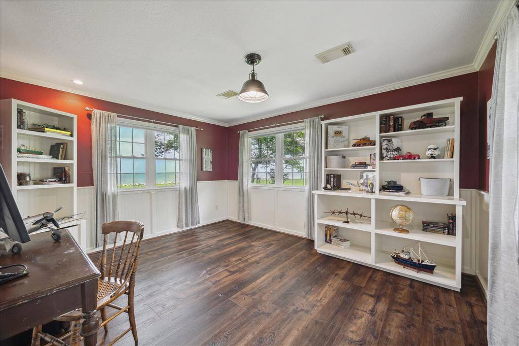 Bedroom 3 is on the lower level and has two double windows that have a view of the bay.