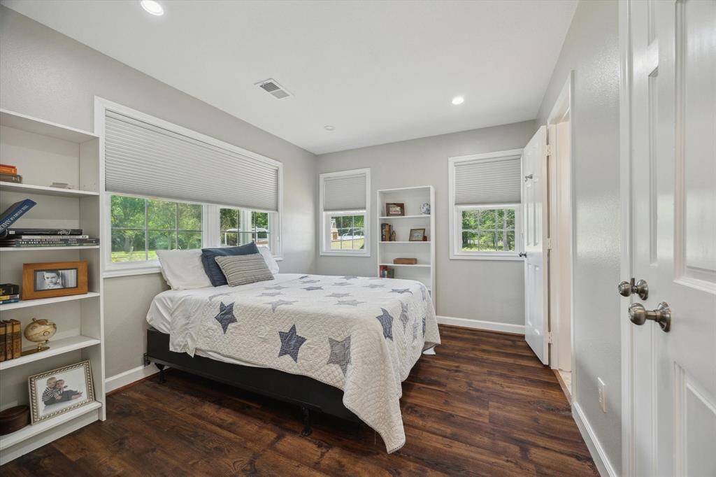 Lower level bedroom 4 is at the front side of the home. Numerous windows provide lots of natural light and this bedroom has an en-suite bath. This room can serve as a great guest suite.