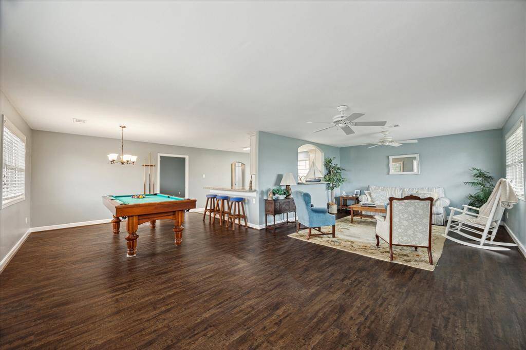 A view of the garage apartment when entering. The apartment has engineered wood flooring and offers an open concept design.