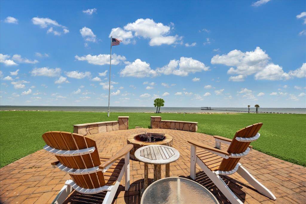 Another view of the patio with firepit that overlooks the bay.