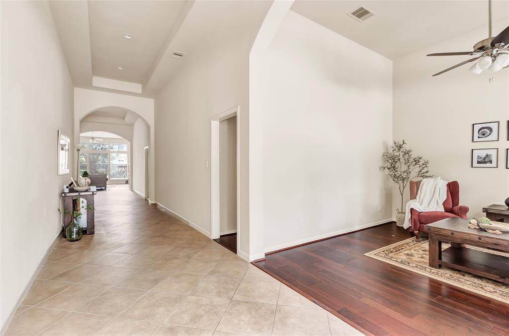 Front Entry with 2 hallways to secondary bedrooms