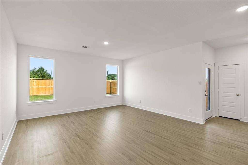As you wander through the open floor plan, you’ll notice high ceilings that elevate the ambiance, while carefully chosen materials add a touch of luxury without losing that cozy feel.