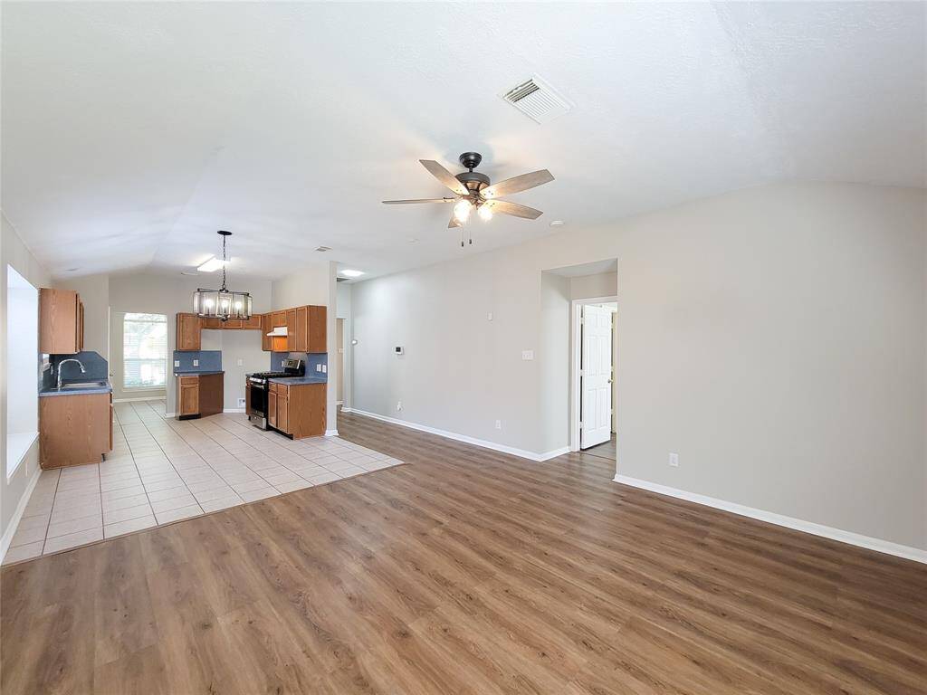 Discover the primary bedroom adjacent to the cozy den.