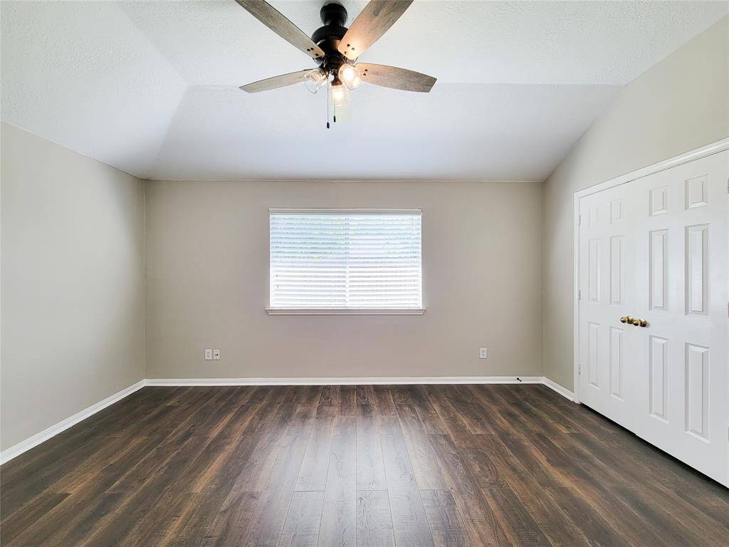 Experience the comfort of vaulted ceilings and enjoy the modern upgraded ceiling fan with light in the primary bedroom.