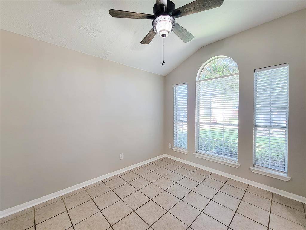 Enjoy the open feel of high ceilings, complemented by an upgraded fan and abundant natural light from large front windows.