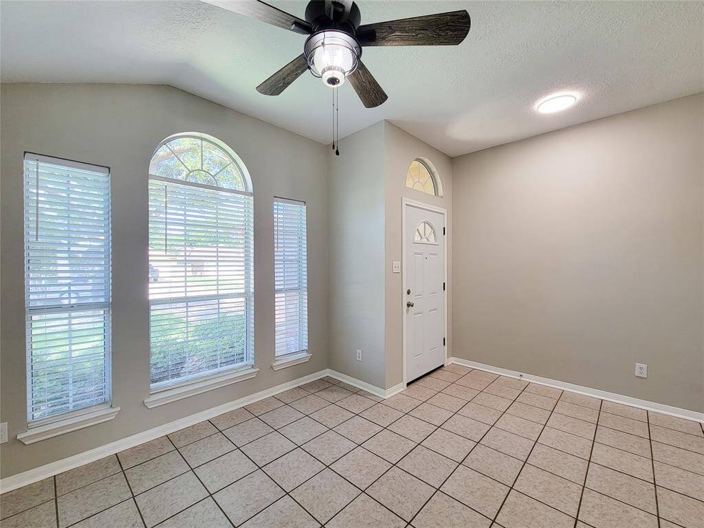 Welcome home to a newly updated front door and bright LED-lit foyer, offering a warm and inviting entrance.