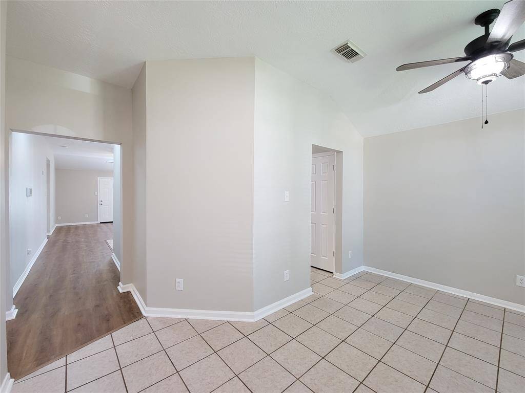 Experience seamless flow from the hallway into the spacious den or through the dining area to the inviting kitchen.