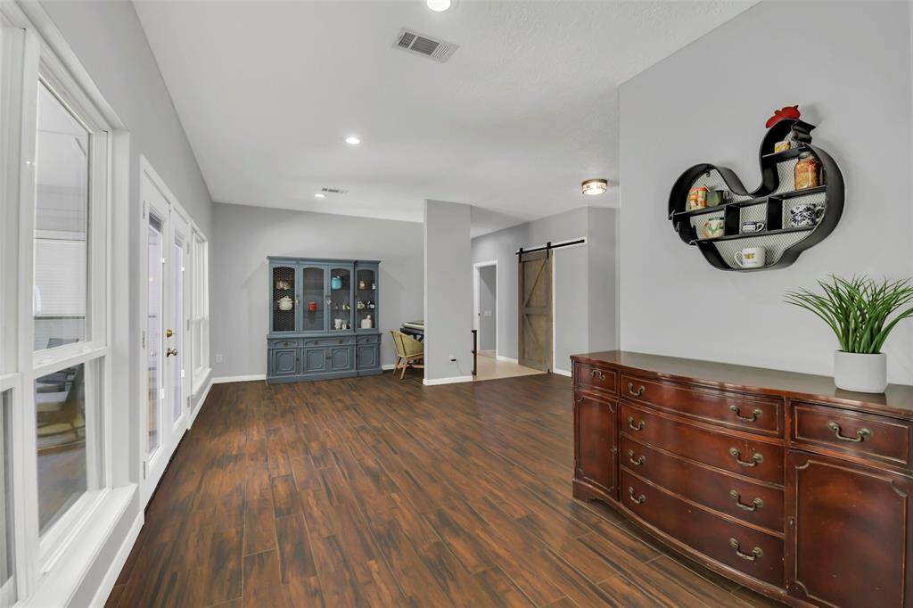 View from kitchen to entry, back yard, another nook for an office or reading area.