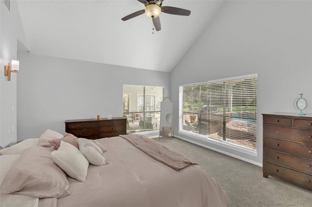 Another view of primary bedroom with lots of sunlight.