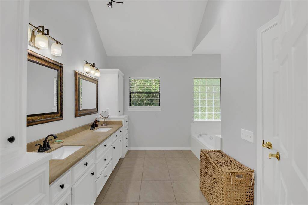 Primary en suite with double sinks with built-ins.