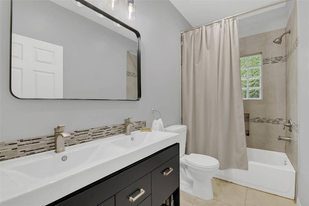 Guest bathroom with double sinks.