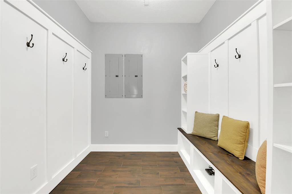 Mud room with built-in cabinets, and storage.