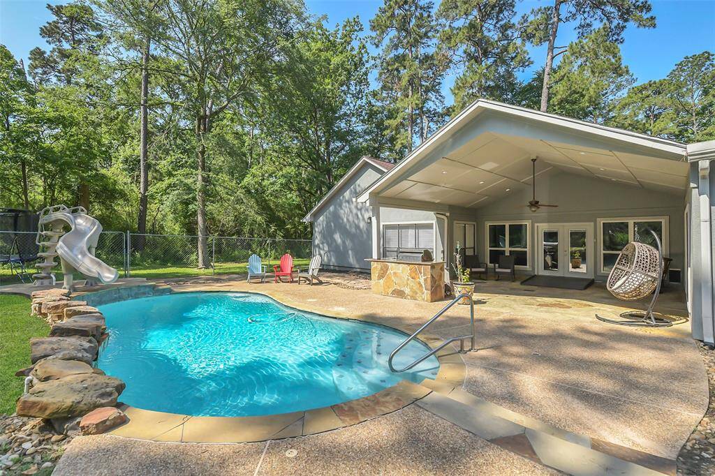 Another view of pool and back covered patio.