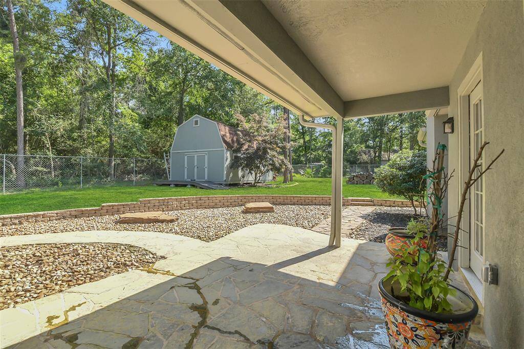 View from the small covered porch and backyard shed.