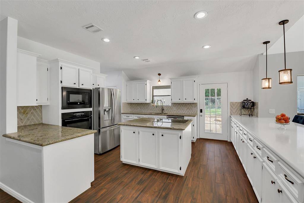 Another view of the kitchen. Plenty of counter and cabinet space too!