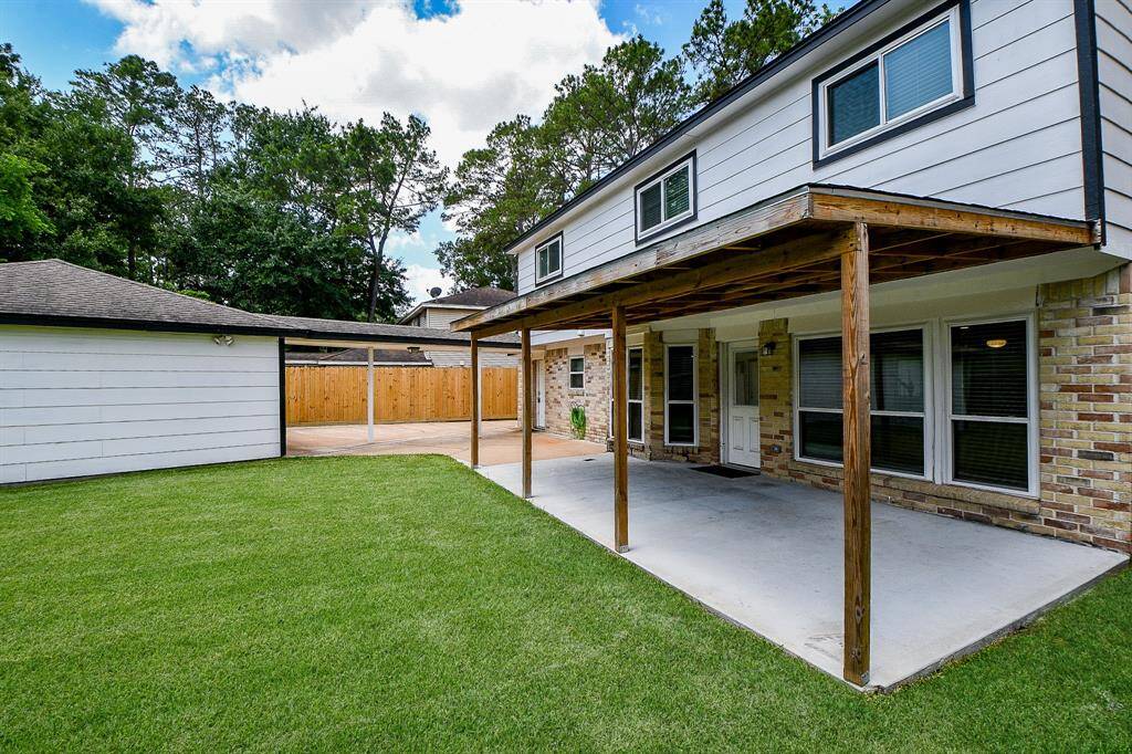 The patio is set upon a durable concrete slab, ensuring a stable foundation for furniture or decorative elements.