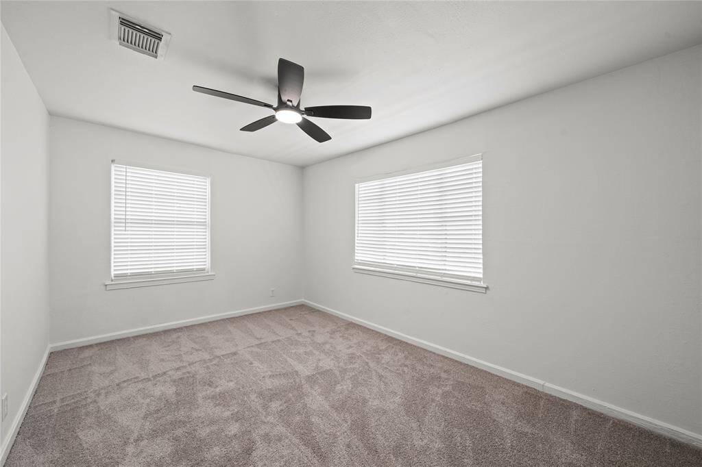 Spacious Primary Bedroom W/ dual Windows & Views of Front & Side Yard