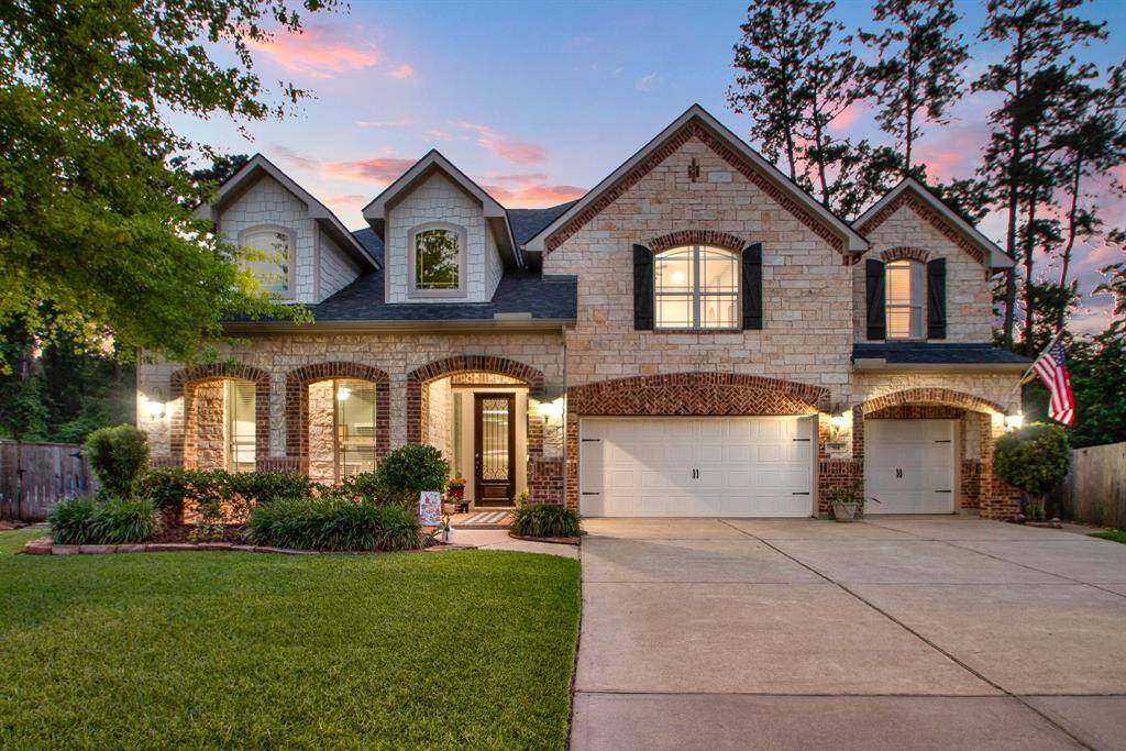A place to call "home"! Amazing curb appeal with lush landscaping, brick and stone exterior, 3-car garage and covered front porch highlighted by bricked archways.